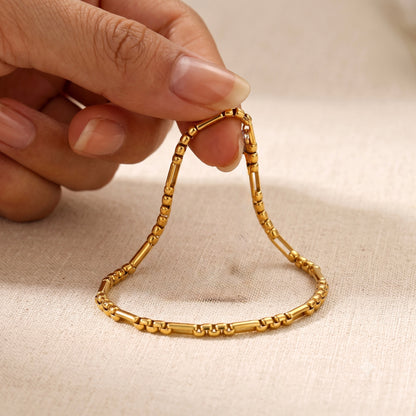 Pulsera de eslabones dorada en acero y oro 18k