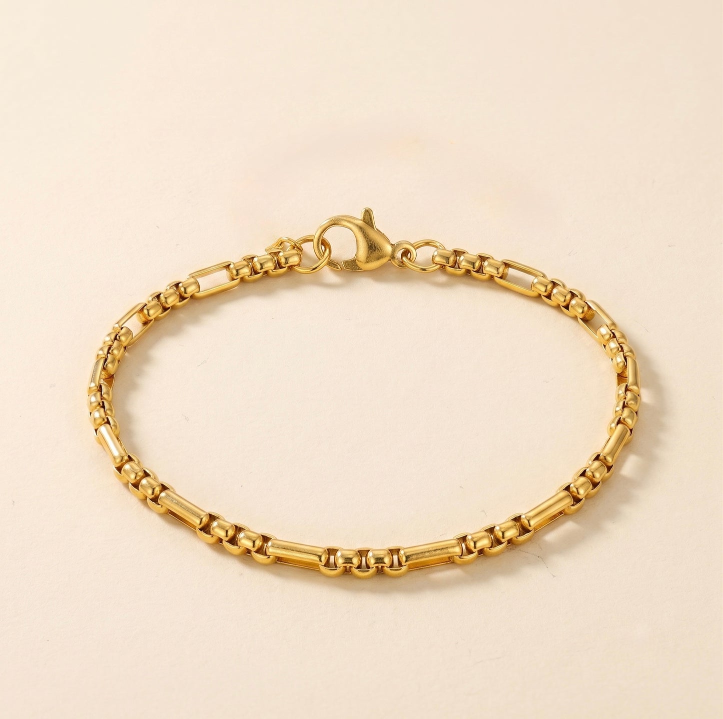 Pulsera de eslabones dorada en acero y oro 18k