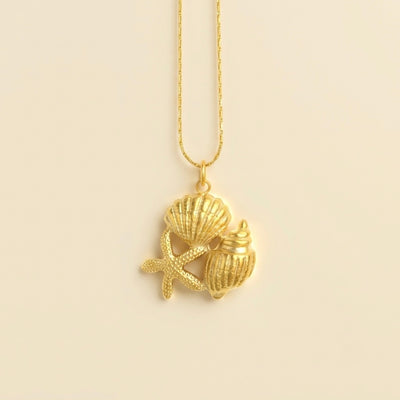 Collier triple en coquillage, cauri et étoile de mer doré