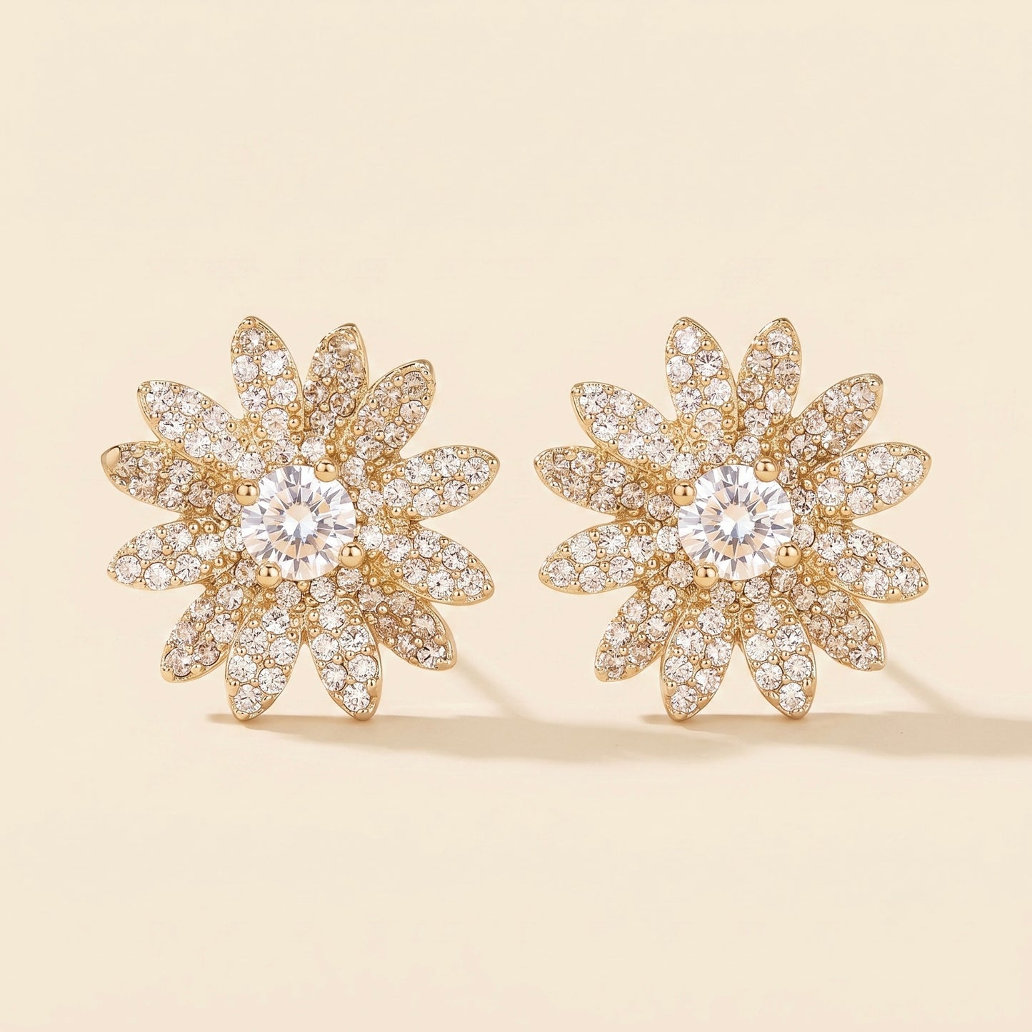 Pendientes de margarita con circonita en acero y oro 18k