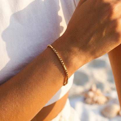 Pulseira de elos dourada em aço e ouro 18k