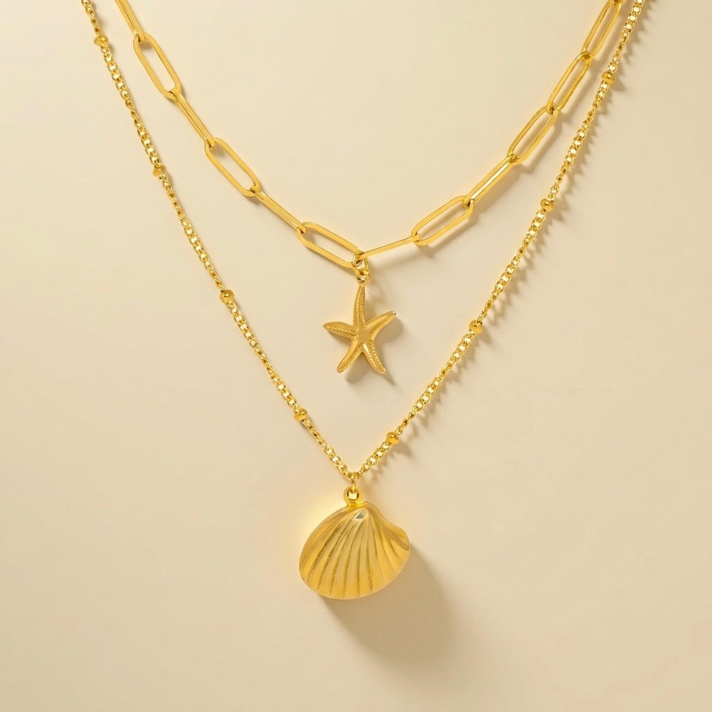 Collar doble de concha y caracola en acero y oro 18k