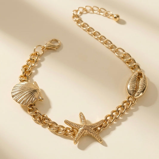 Pulsera triple de concha, caracola y estrella de mar dorada