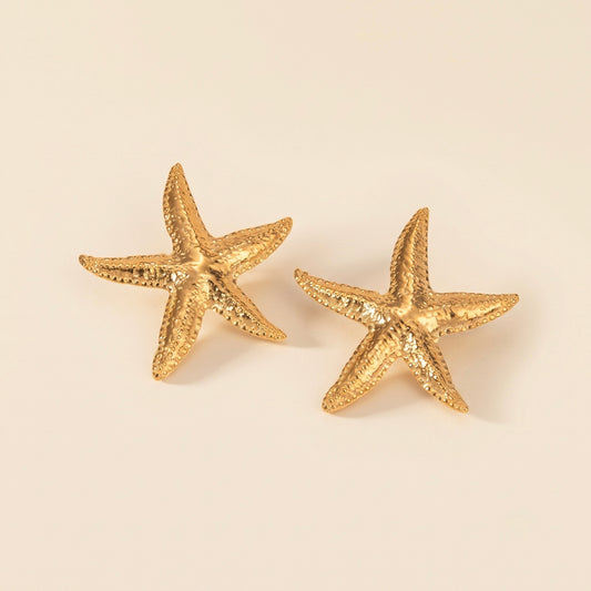 Pendientes de estrella de mar dorados en acero y oro 18k