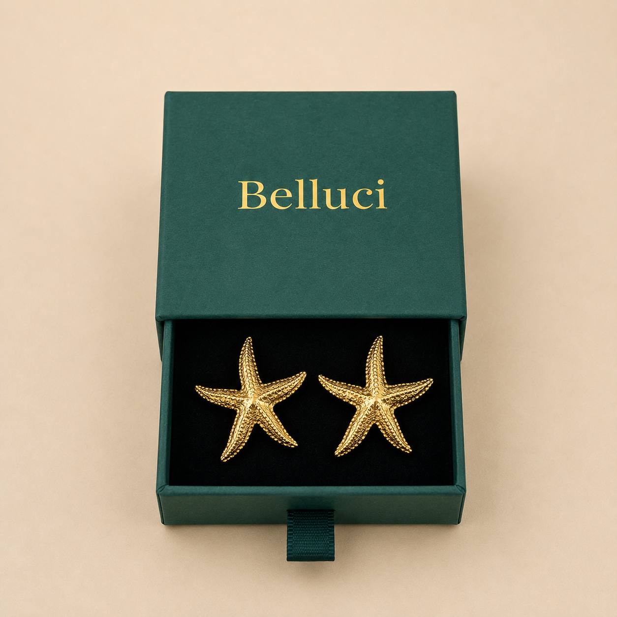 Pendientes de estrella de mar dorados en acero y oro 18k